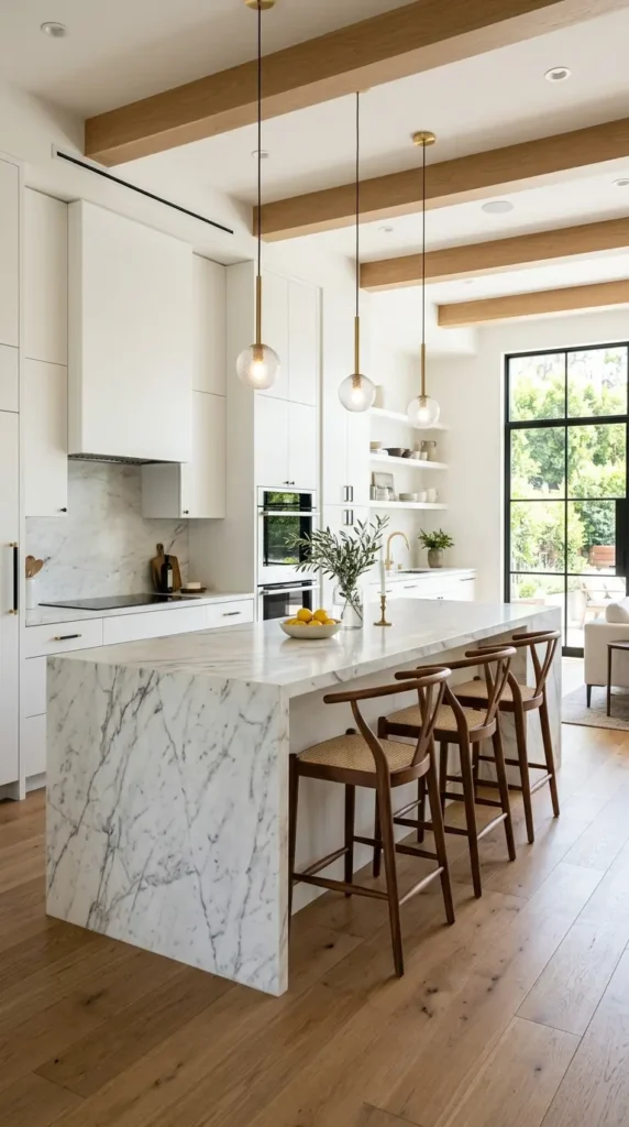 Modern kitchen with marble island, wooden stools, and white cabinets